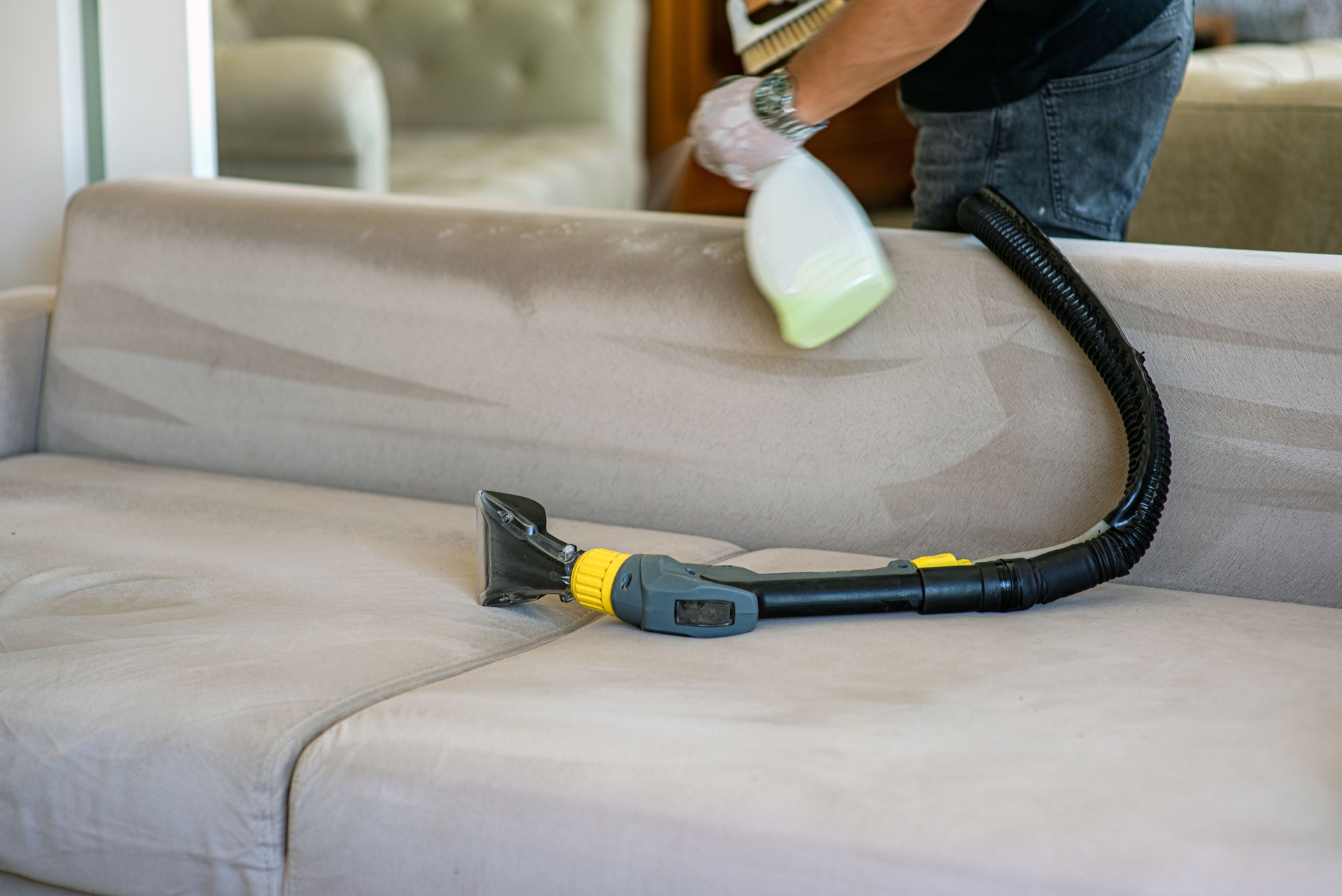 Spraying soapy water for sofa washing TURKIYE